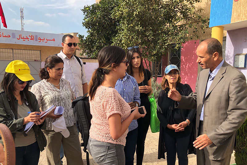 MCM DG Rima El Allali talking to the Director of the Rhamna Primary School.